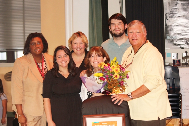 The Office Depot Foundation staff, Dr. Jo Nemeth, and Mrs. Raynor with her family.